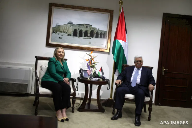 U.S. Secretary of State Hillary Rodham Clinton, shakes hands with Palestinian President Mahmoud Abbas during a meeting in the West Bank city of Ramallah, Wednesday, Nov. 21, 2012. Clinton will try on Wednesday to wring a...
