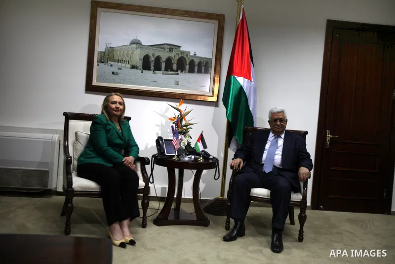 U.S. Secretary of State Hillary Rodham Clinton, shakes hands with Palestinian President Mahmoud Abbas during a meeting in the West Bank city of Ramallah, Wednesday, Nov. 21, 2012. Clinton will try on Wednesday to wring a...