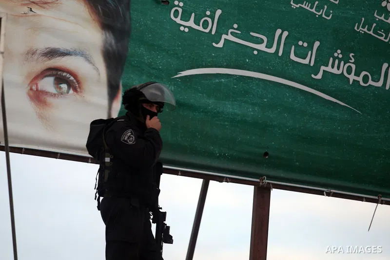 Israeli soldiers fire tear gas towards stone throwers demonstrating against the Israeli military offensive on the Gaza Strip at the Qalandia checkpoint, in the Israeli occupied West Bank, on November 21, 2012 .Israel lau...