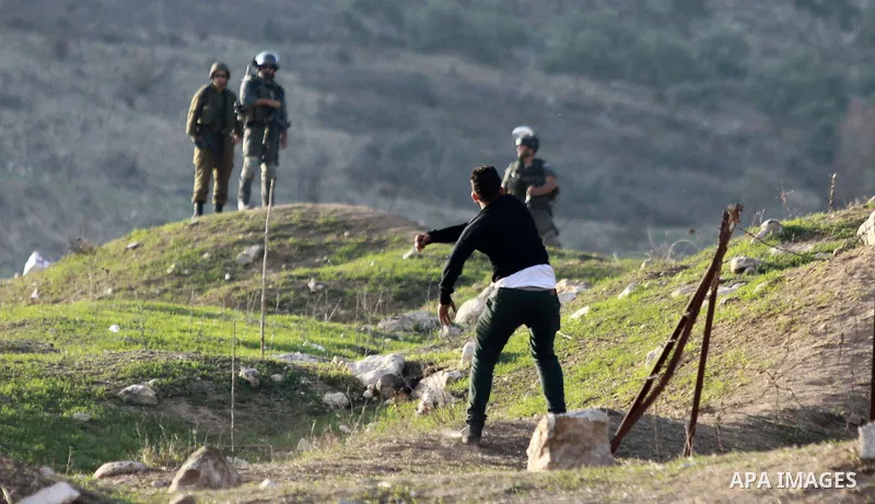 Palestinian protesters throw stones at Israeli soldiers during clashes in the West Bank city of Nablus, on November 21, 2012. The West Bank has witnessed almost daily demonstrations in support of Gaza Palestinians who ha...