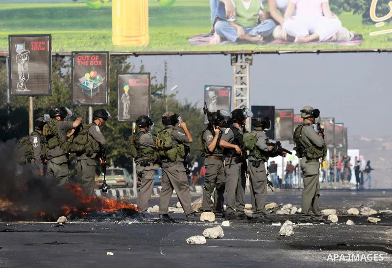 Israeli soldiers fire tear gas at Palestinian protesters during clashes in the West Bank city of Nablus, on November 21, 2012. The West Bank has witnessed almost daily demonstrations in support of Gaza Palestinians who h...