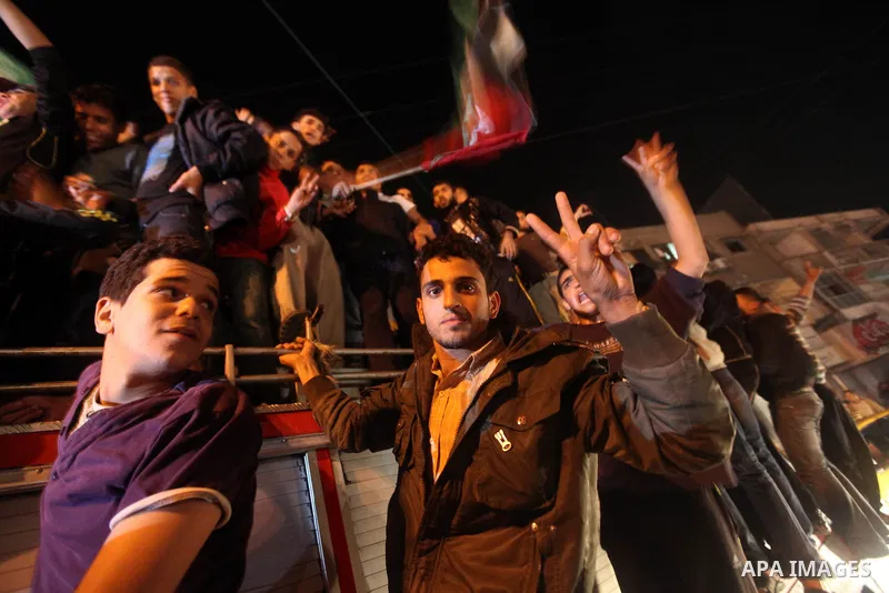 Palestinians celebrate what they say is a victory over Israel after an eight-day conflict in Gaza City, November 21, 2012. Israel and the Islamist Hamas movement agreed on Wednesday to an Egyptian-sponsored ceasefire to...