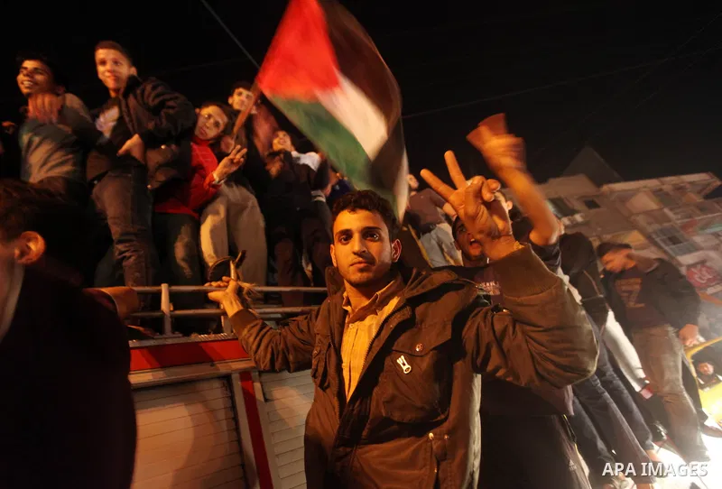 Palestinians celebrate what they say is a victory over Israel after an eight-day conflict in Gaza City, November 21, 2012. Israel and the Islamist Hamas movement agreed on Wednesday to an Egyptian-sponsored ceasefire to...