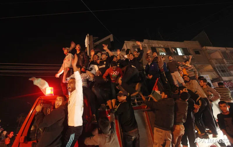 Palestinians celebrate what they say is a victory over Israel after an eight-day conflict in Gaza City, November 21, 2012. Israel and the Islamist Hamas movement agreed on Wednesday to an Egyptian-sponsored ceasefire to...