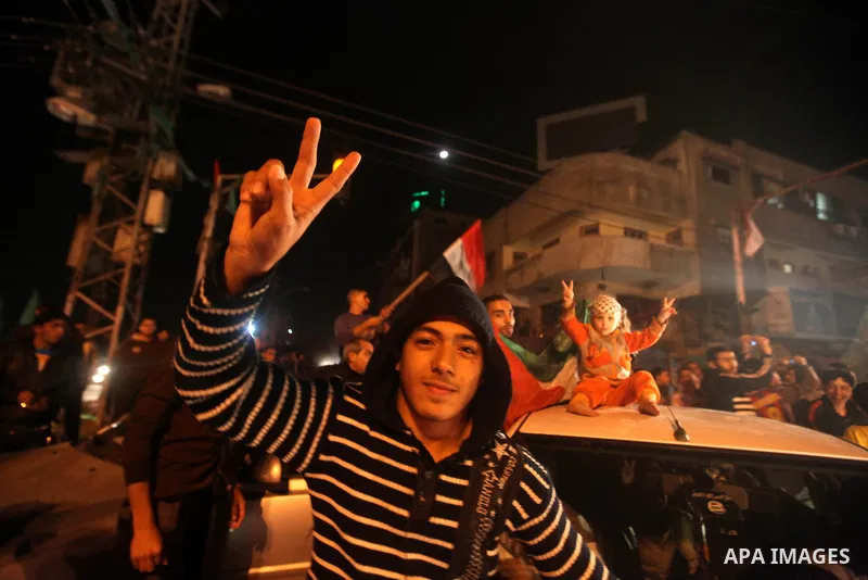 Palestinians celebrate what they say is a victory over Israel after an eight-day conflict in Gaza City, November 21, 2012. Israel and the Islamist Hamas movement agreed on Wednesday to an Egyptian-sponsored ceasefire to...