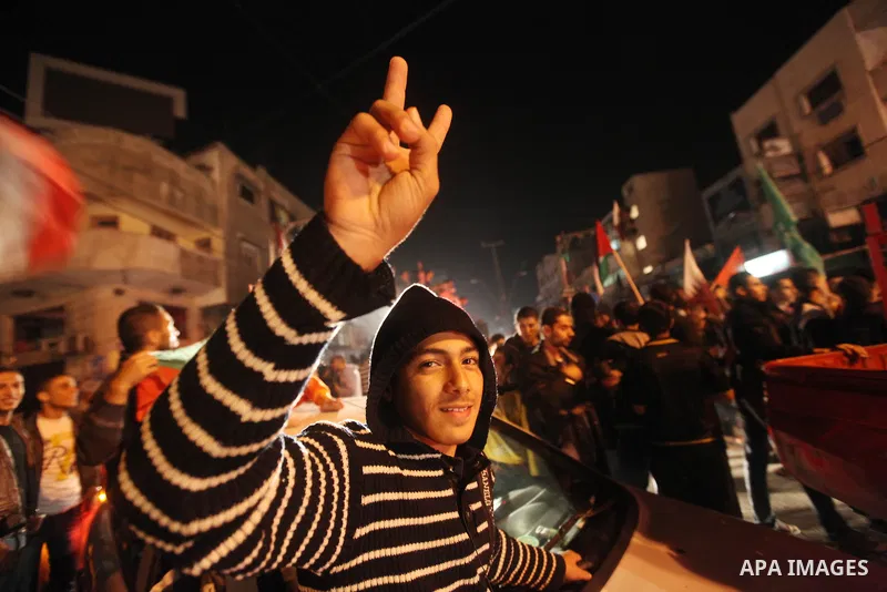 Palestinians celebrate what they say is a victory over Israel after an eight-day conflict in Gaza City, November 21, 2012. Israel and the Islamist Hamas movement agreed on Wednesday to an Egyptian-sponsored ceasefire to...