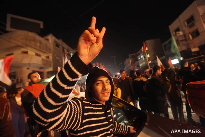 Palestinians celebrate what they say is a victory over Israel after an eight-day conflict in Gaza City, November 21, 2012. Israel and the Islamist Hamas movement agreed on Wednesday to an Egyptian-sponsored ceasefire to...