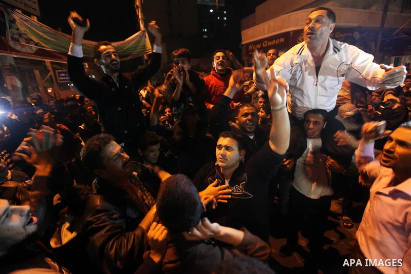 Palestinians celebrate what they say is a victory over Israel after an eight-day conflict in Gaza City, November 21, 2012. Israel and the Islamist Hamas movement agreed on Wednesday to an Egyptian-sponsored ceasefire to...