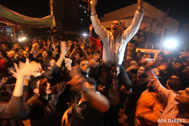 Palestinians celebrate what they say is a victory over Israel after an eight-day conflict in Gaza City, November 21, 2012. Israel and the Islamist Hamas movement agreed on Wednesday to an Egyptian-sponsored ceasefire to...