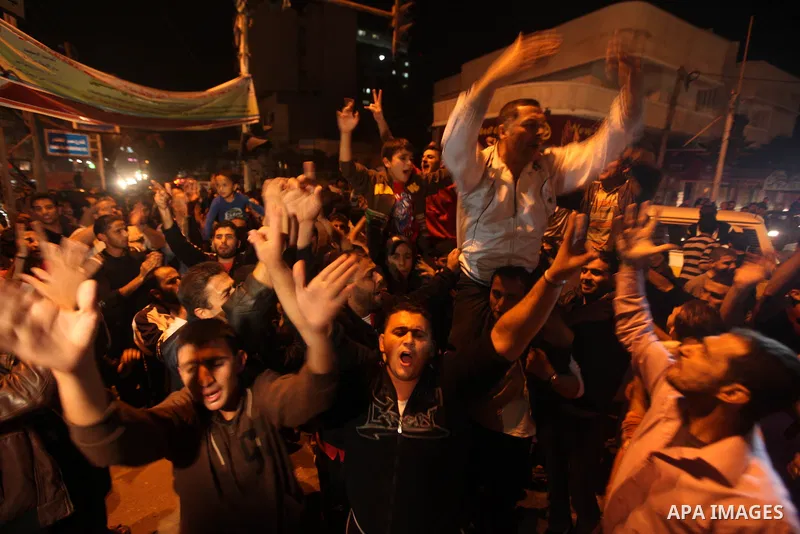 Palestinians celebrate what they say is a victory over Israel after an eight-day conflict in Gaza City, November 21, 2012. Israel and the Islamist Hamas movement agreed on Wednesday to an Egyptian-sponsored ceasefire to...