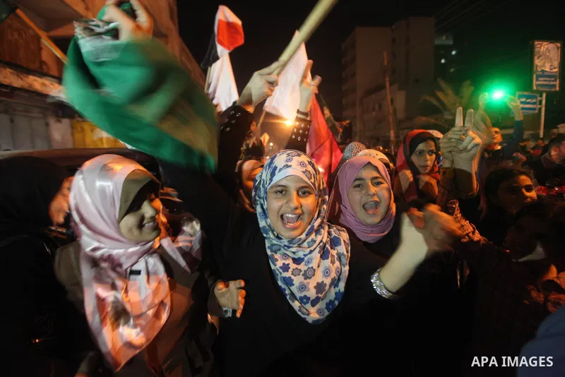 Palestinians celebrate what they say is a victory over Israel after an eight-day conflict in Gaza City, November 21, 2012. Israel and the Islamist Hamas movement agreed on Wednesday to an Egyptian-sponsored ceasefire to...