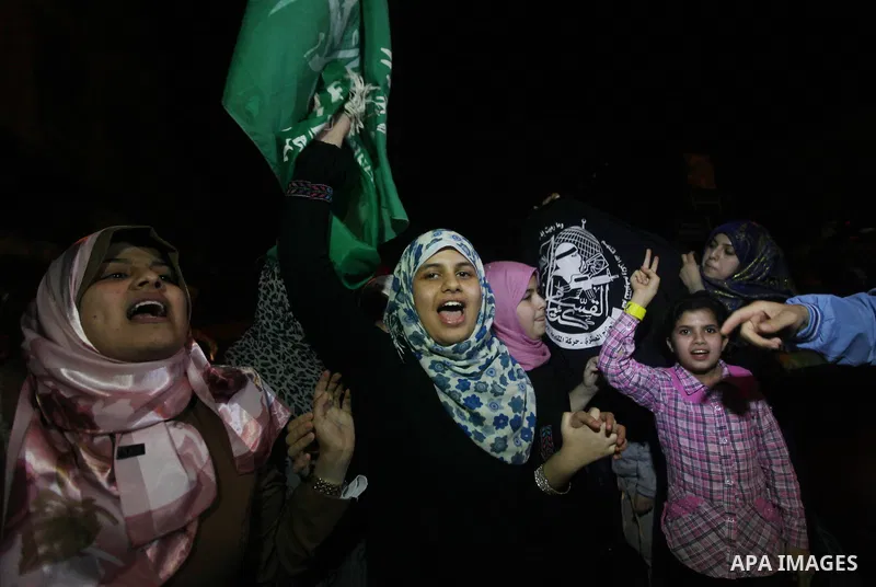 Palestinians celebrate what they say is a victory over Israel after an eight-day conflict in Gaza City, November 21, 2012. Israel and the Islamist Hamas movement agreed on Wednesday to an Egyptian-sponsored ceasefire to...