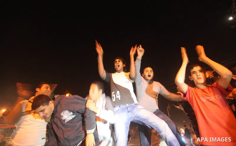 Palestinians celebrate what they say is a victory over Israel after an eight-day conflict in Gaza City, November 21, 2012. Israel and the Islamist Hamas movement agreed on Wednesday to an Egyptian-sponsored ceasefire to...