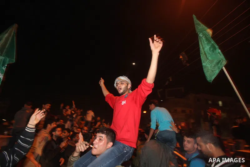 Palestinians celebrate what they say is a victory over Israel after an eight-day conflict in Gaza City, November 21, 2012. Israel and the Islamist Hamas movement agreed on Wednesday to an Egyptian-sponsored ceasefire to...