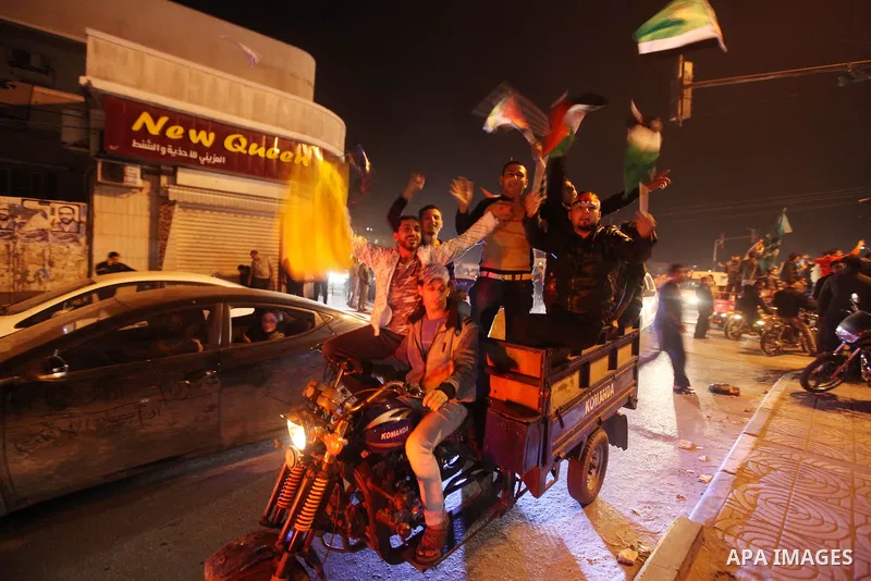 Palestinians celebrate what they say is a victory over Israel after an eight-day conflict in Gaza City, November 21, 2012. Israel and the Islamist Hamas movement agreed on Wednesday to an Egyptian-sponsored ceasefire to...