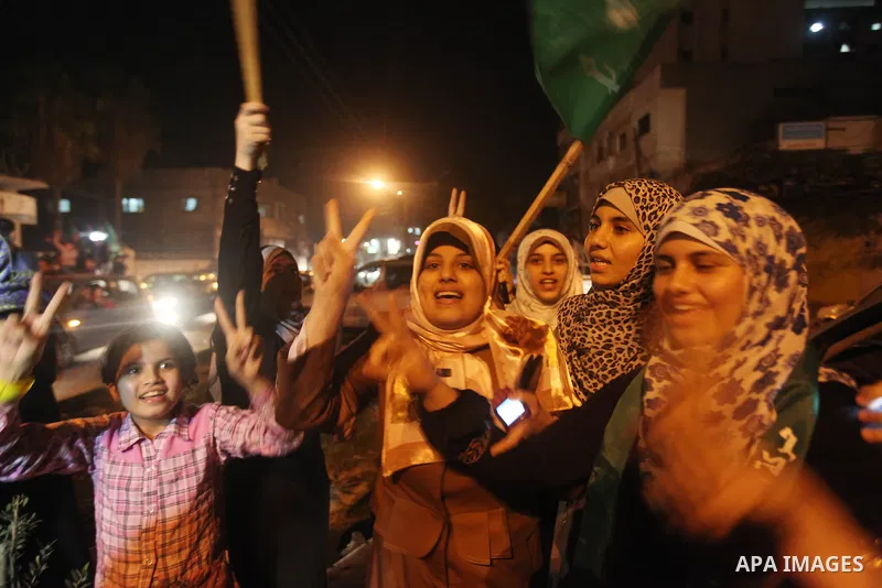 Palestinians celebrate what they say is a victory over Israel after an eight-day conflict in Gaza City, November 21, 2012. Israel and the Islamist Hamas movement agreed on Wednesday to an Egyptian-sponsored ceasefire to...
