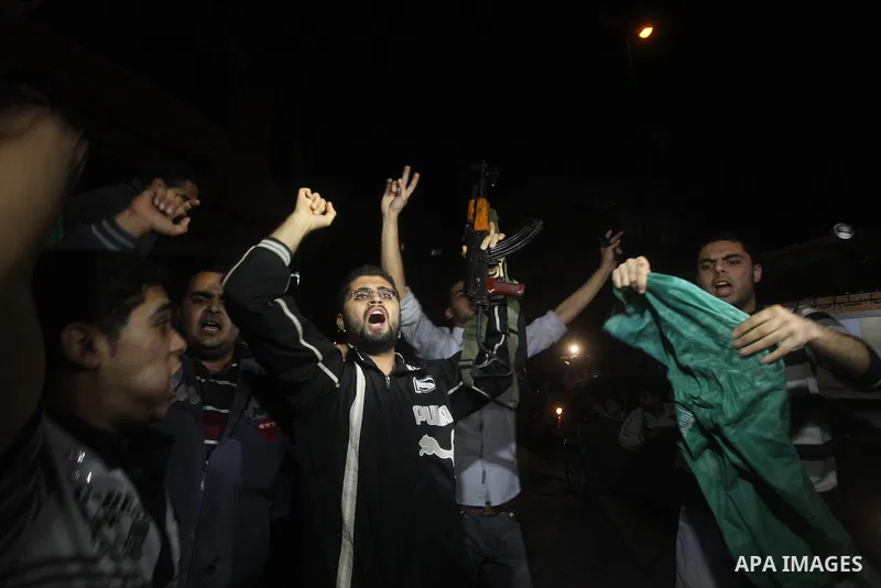 Palestinians celebrate what they say is a victory over Israel after an eight-day conflict in Gaza City, November 21, 2012. Israel and the Islamist Hamas movement agreed on Wednesday to an Egyptian-sponsored ceasefire to...