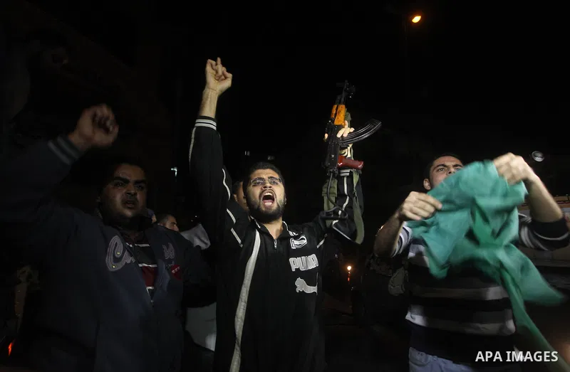 Palestinians celebrate what they say is a victory over Israel after an eight-day conflict in Gaza City, November 21, 2012. Israel and the Islamist Hamas movement agreed on Wednesday to an Egyptian-sponsored ceasefire to...