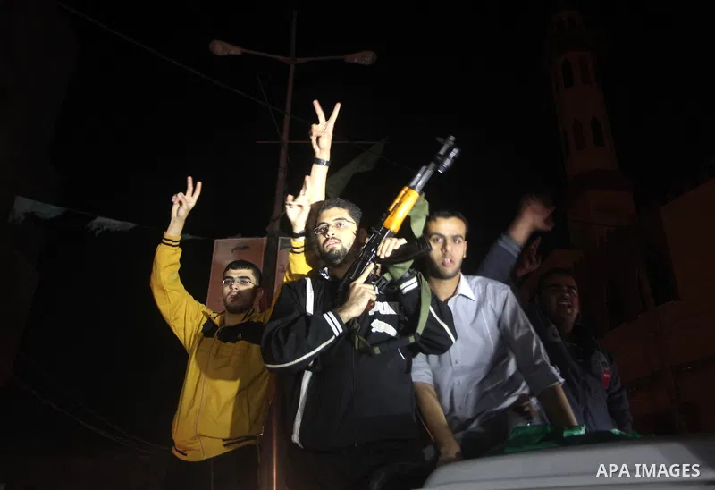 Palestinians celebrate what they say is a victory over Israel after an eight-day conflict in Gaza City, November 21, 2012. Israel and the Islamist Hamas movement agreed on Wednesday to an Egyptian-sponsored ceasefire to...