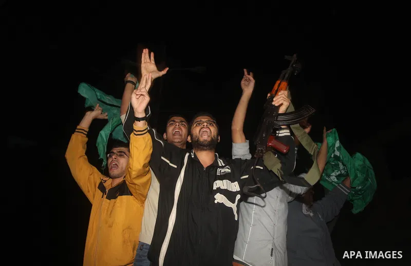 Palestinians celebrate what they say is a victory over Israel after an eight-day conflict in Gaza City, November 21, 2012. Israel and the Islamist Hamas movement agreed on Wednesday to an Egyptian-sponsored ceasefire to...