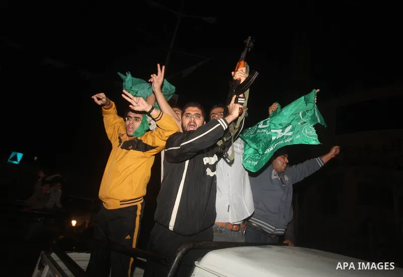 Palestinians celebrate what they say is a victory over Israel after an eight-day conflict in Gaza City, November 21, 2012. Israel and the Islamist Hamas movement agreed on Wednesday to an Egyptian-sponsored ceasefire to...