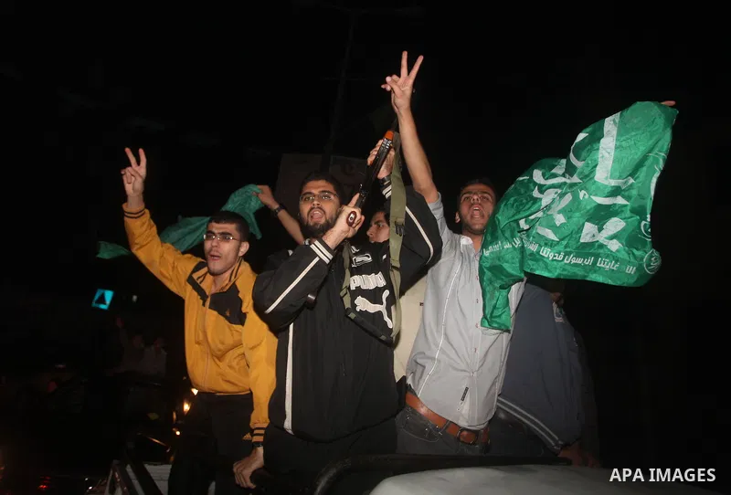 Palestinians celebrate what they say is a victory over Israel after an eight-day conflict in Gaza City, November 21, 2012. Israel and the Islamist Hamas movement agreed on Wednesday to an Egyptian-sponsored ceasefire to...