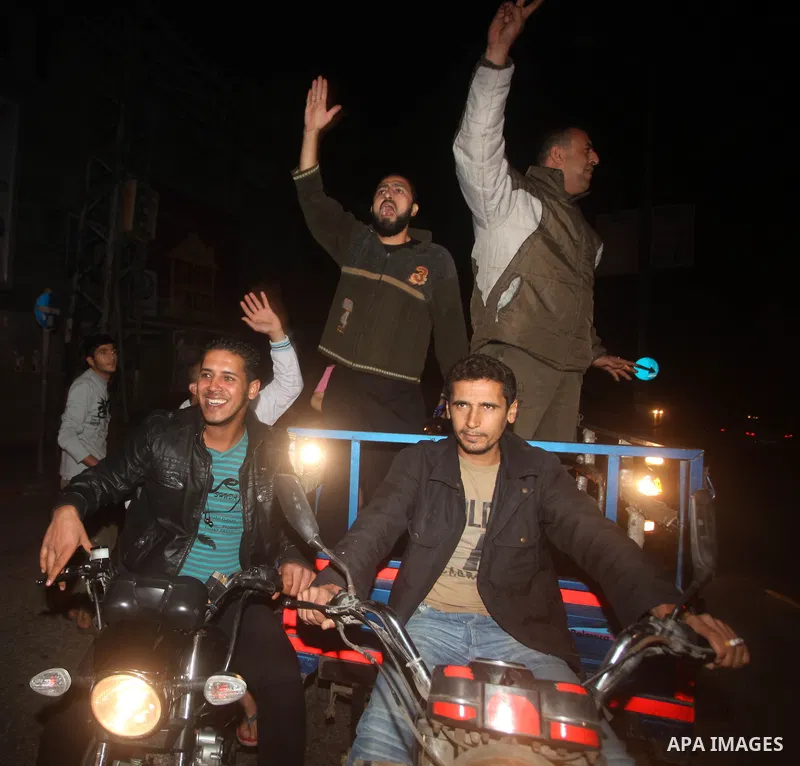 Palestinians celebrate what they say is a victory over Israel after an eight-day conflict in Gaza City, November 21, 2012. Israel and the Islamist Hamas movement agreed on Wednesday to an Egyptian-sponsored ceasefire to...