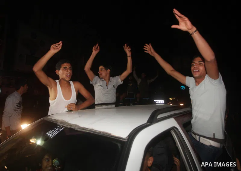 Palestinians celebrate what they say is a victory over Israel after an eight-day conflict in Gaza City, November 21, 2012. Israel and the Islamist Hamas movement agreed on Wednesday to an Egyptian-sponsored ceasefire to...