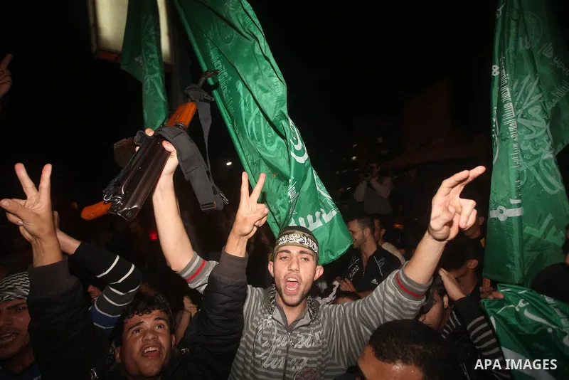 Palestinians celebrate what they say is a victory over Israel after an eight-day conflict in Gaza City, November 21, 2012. Israel and the Islamist Hamas movement agreed on Wednesday to an Egyptian-sponsored ceasefire to...