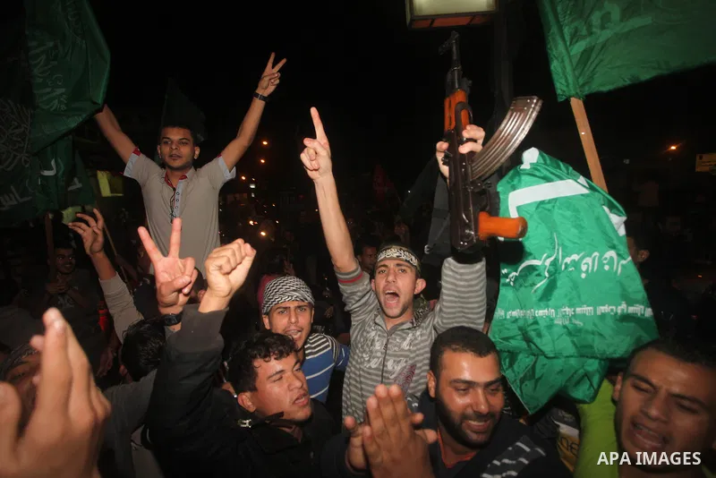 Palestinians celebrate what they say is a victory over Israel after an eight-day conflict in Gaza City, November 21, 2012. Israel and the Islamist Hamas movement agreed on Wednesday to an Egyptian-sponsored ceasefire to...