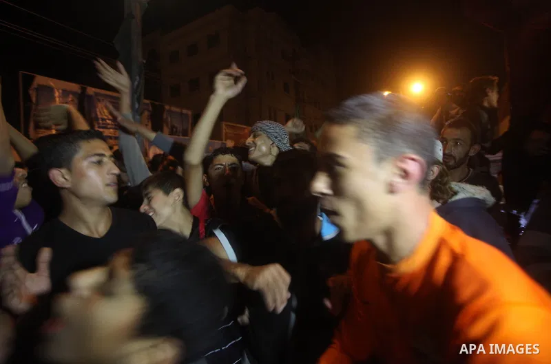 Palestinians celebrate what they say is a victory over Israel after an eight-day conflict in Gaza City, November 21, 2012. Israel and the Islamist Hamas movement agreed on Wednesday to an Egyptian-sponsored ceasefire to...