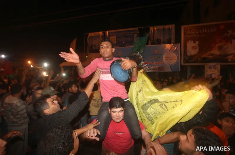 Palestinians celebrate what they say is a victory over Israel after an eight-day conflict in Gaza City, November 21, 2012. Israel and the Islamist Hamas movement agreed on Wednesday to an Egyptian-sponsored ceasefire to...
