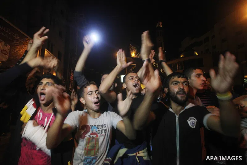 Palestinians celebrate what they say is a victory over Israel after an eight-day conflict in Gaza City, November 21, 2012. Israel and the Islamist Hamas movement agreed on Wednesday to an Egyptian-sponsored ceasefire to...