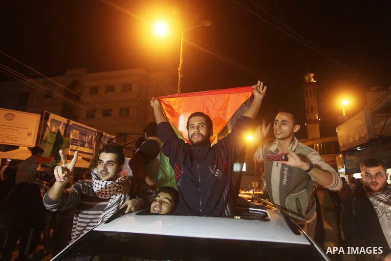 Palestinians celebrate what they say is a victory over Israel after an eight-day conflict in Gaza City, November 21, 2012. Israel and the Islamist Hamas movement agreed on Wednesday to an Egyptian-sponsored ceasefire to...