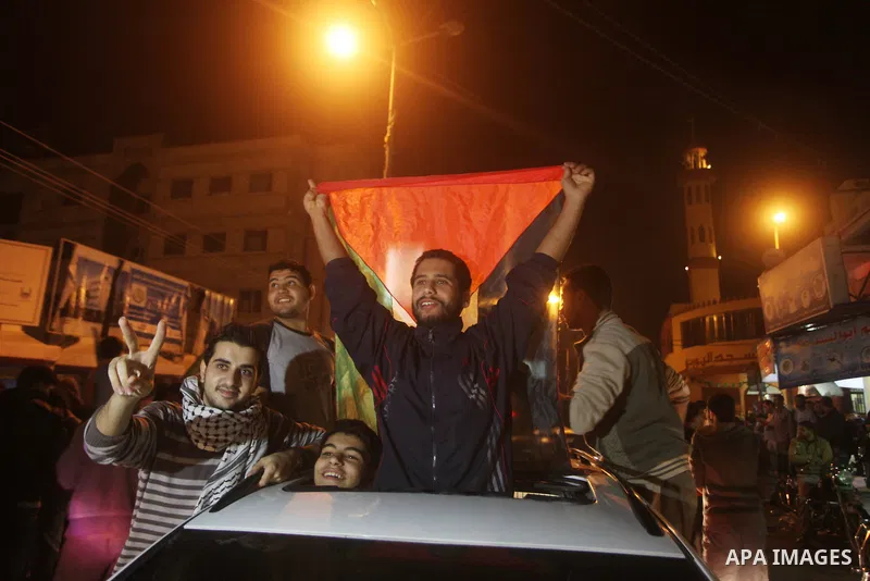 Palestinians celebrate what they say is a victory over Israel after an eight-day conflict in Gaza City, November 21, 2012. Israel and the Islamist Hamas movement agreed on Wednesday to an Egyptian-sponsored ceasefire to...