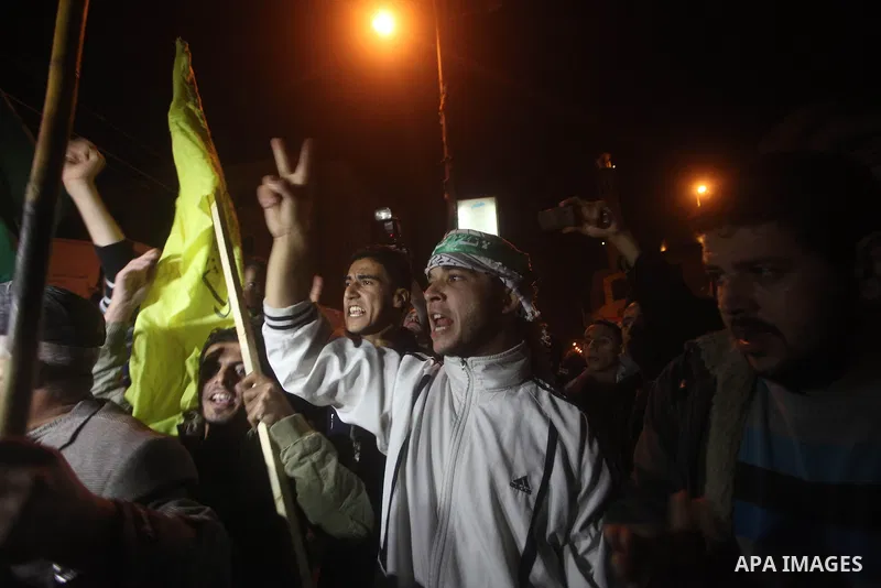 Palestinians celebrate what they say is a victory over Israel after an eight-day conflict in Gaza City, November 21, 2012. Israel and the Islamist Hamas movement agreed on Wednesday to an Egyptian-sponsored ceasefire to...