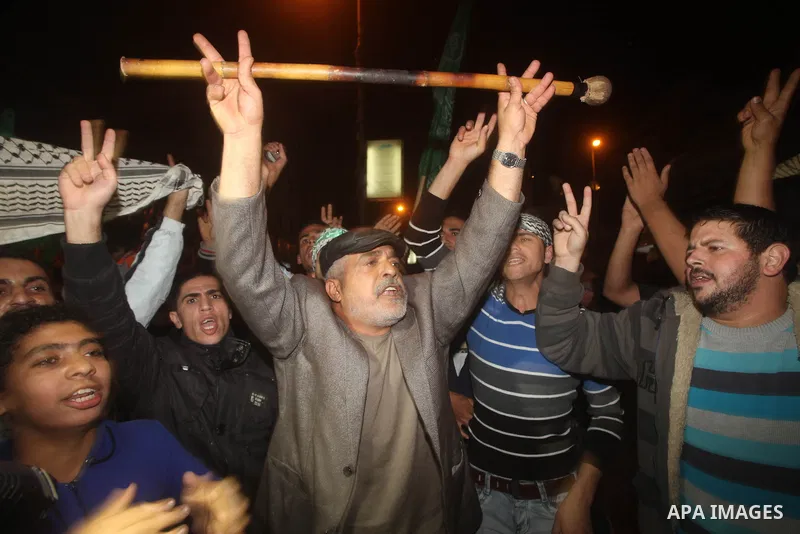 Palestinians celebrate what they say is a victory over Israel after an eight-day conflict in Gaza City, November 21, 2012. Israel and the Islamist Hamas movement agreed on Wednesday to an Egyptian-sponsored ceasefire to...