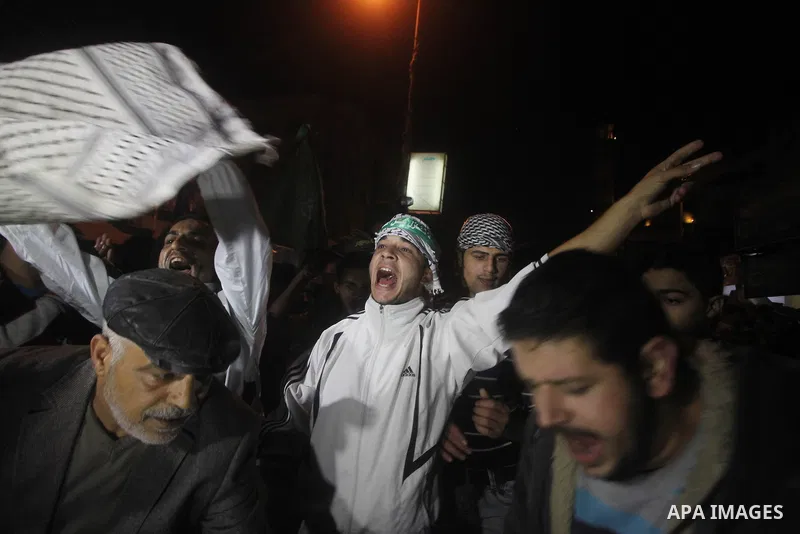 Palestinians celebrate what they say is a victory over Israel after an eight-day conflict in Gaza City, November 21, 2012. Israel and the Islamist Hamas movement agreed on Wednesday to an Egyptian-sponsored ceasefire to...