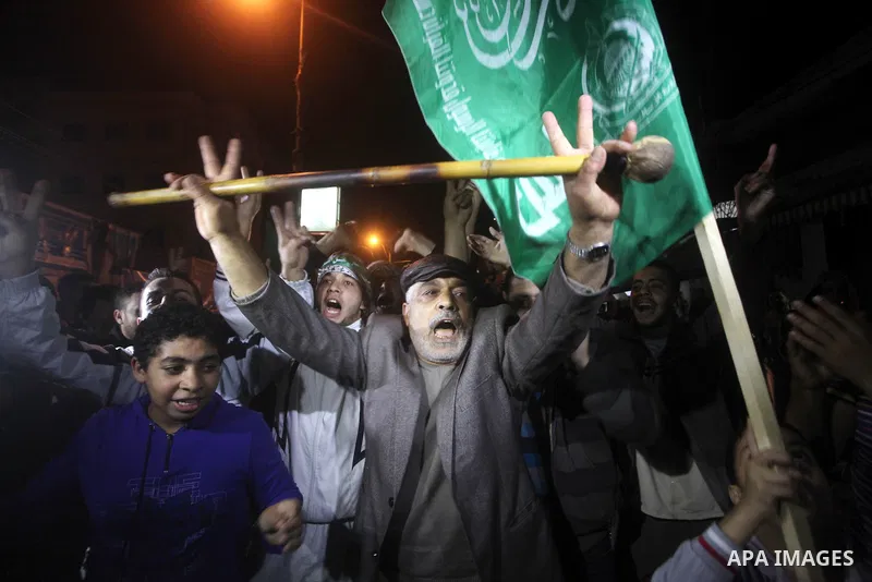 Palestinians celebrate what they say is a victory over Israel after an eight-day conflict in Gaza City, November 21, 2012. Israel and the Islamist Hamas movement agreed on Wednesday to an Egyptian-sponsored ceasefire to...