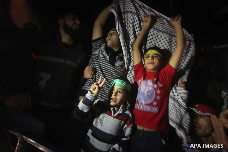 Palestinians celebrate what they say is a victory over Israel after an eight-day conflict in Gaza City, November 21, 2012. Israel and the Islamist Hamas movement agreed on Wednesday to an Egyptian-sponsored ceasefire to...