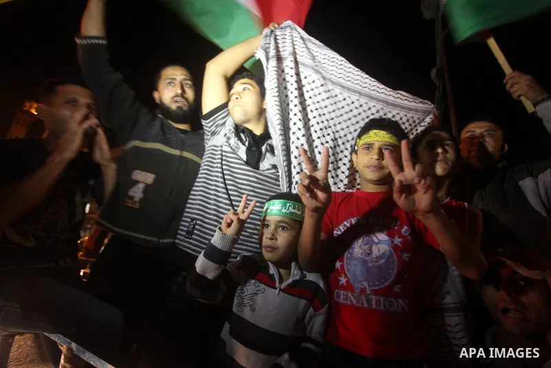 Palestinians celebrate what they say is a victory over Israel after an eight-day conflict in Gaza City, November 21, 2012. Israel and the Islamist Hamas movement agreed on Wednesday to an Egyptian-sponsored ceasefire to...