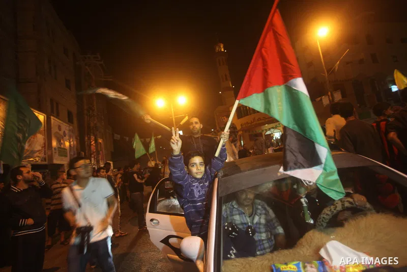 Palestinians celebrate what they say is a victory over Israel after an eight-day conflict in Gaza City, November 21, 2012. Israel and the Islamist Hamas movement agreed on Wednesday to an Egyptian-sponsored ceasefire to...