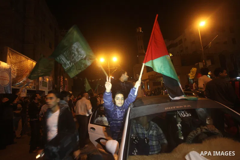 Palestinians celebrate what they say is a victory over Israel after an eight-day conflict in Gaza City, November 21, 2012. Israel and the Islamist Hamas movement agreed on Wednesday to an Egyptian-sponsored ceasefire to...
