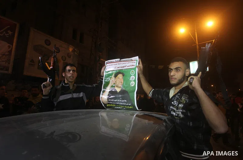 Palestinians celebrate what they say is a victory over Israel after an eight-day conflict in Gaza City, November 21, 2012. Israel and the Islamist Hamas movement agreed on Wednesday to an Egyptian-sponsored ceasefire to...