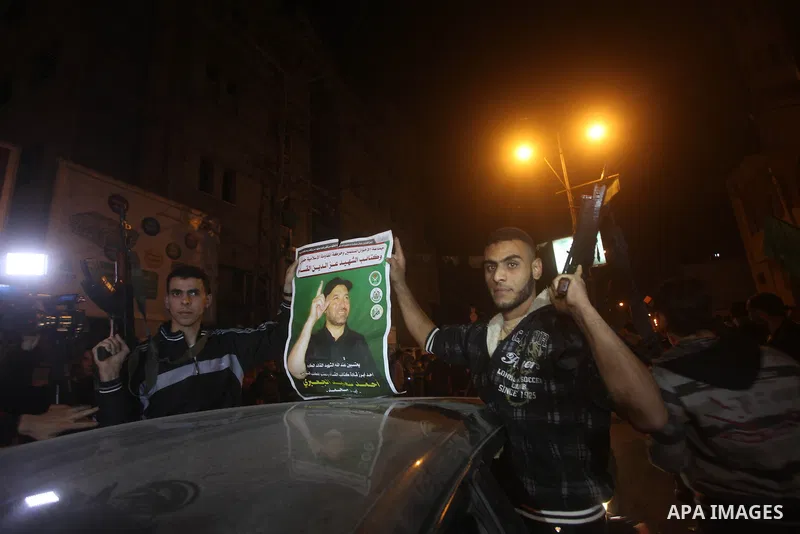 Palestinians celebrate what they say is a victory over Israel after an eight-day conflict in Gaza City, November 21, 2012. Israel and the Islamist Hamas movement agreed on Wednesday to an Egyptian-sponsored ceasefire to...