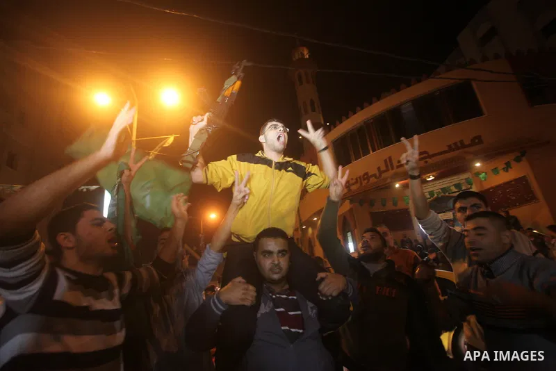 Palestinians celebrate what they say is a victory over Israel after an eight-day conflict in Gaza City, November 21, 2012. Israel and the Islamist Hamas movement agreed on Wednesday to an Egyptian-sponsored ceasefire to...