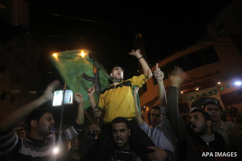 Palestinians celebrate what they say is a victory over Israel after an eight-day conflict in Gaza City, November 21, 2012. Israel and the Islamist Hamas movement agreed on Wednesday to an Egyptian-sponsored ceasefire to...