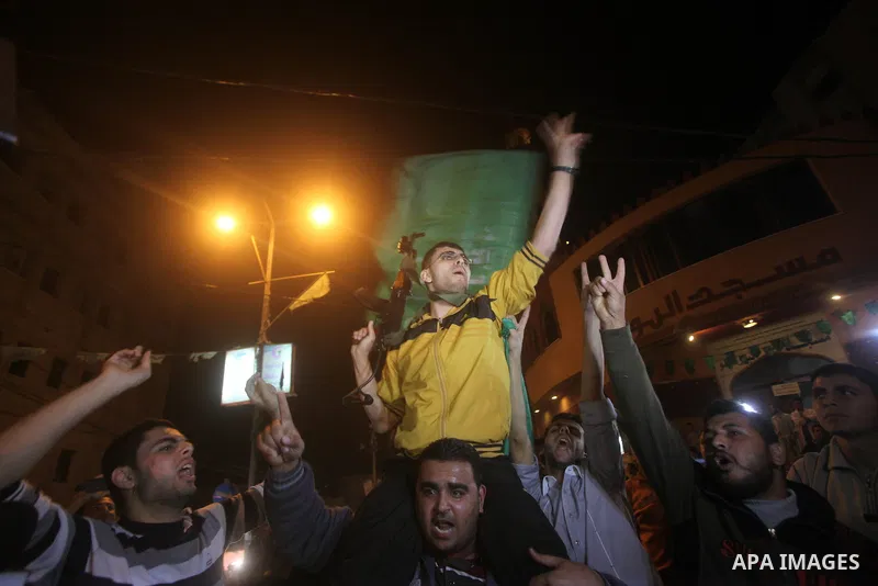 Palestinians celebrate what they say is a victory over Israel after an eight-day conflict in Gaza City, November 21, 2012. Israel and the Islamist Hamas movement agreed on Wednesday to an Egyptian-sponsored ceasefire to...