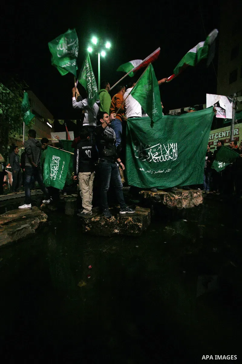 Palestinians celebrate what they say is a victory over Israel after an eight-day conflict, in the West Bank city of Hebron, November 21, 2012. Israel and the Islamist Hamas movement agreed on Wednesday to an Egyptian-spo...