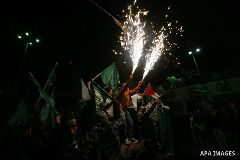 Palestinians celebrate what they say is a victory over Israel after an eight-day conflict, in the West Bank city of Hebron, November 21, 2012. Israel and the Islamist Hamas movement agreed on Wednesday to an Egyptian-spo...